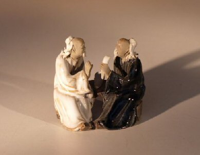 Miniature Glazed Figurine<br>Two Men Sitting at Table