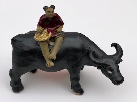 Ceramic Figurine<br>Boy Sitting On Standing Buffalo