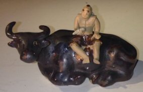 Ceramic Figure<br>Man Sitting On Sitting Buffalo<br>Size Large